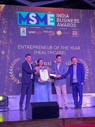Vamsi Talasila receiving the Entrepreneur of the Year (Healthcare) award on stage at the MSME India Business Awards
